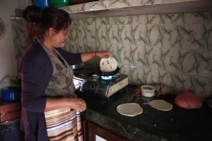 Our host prepares balep korun, Tibetan flat bread.
